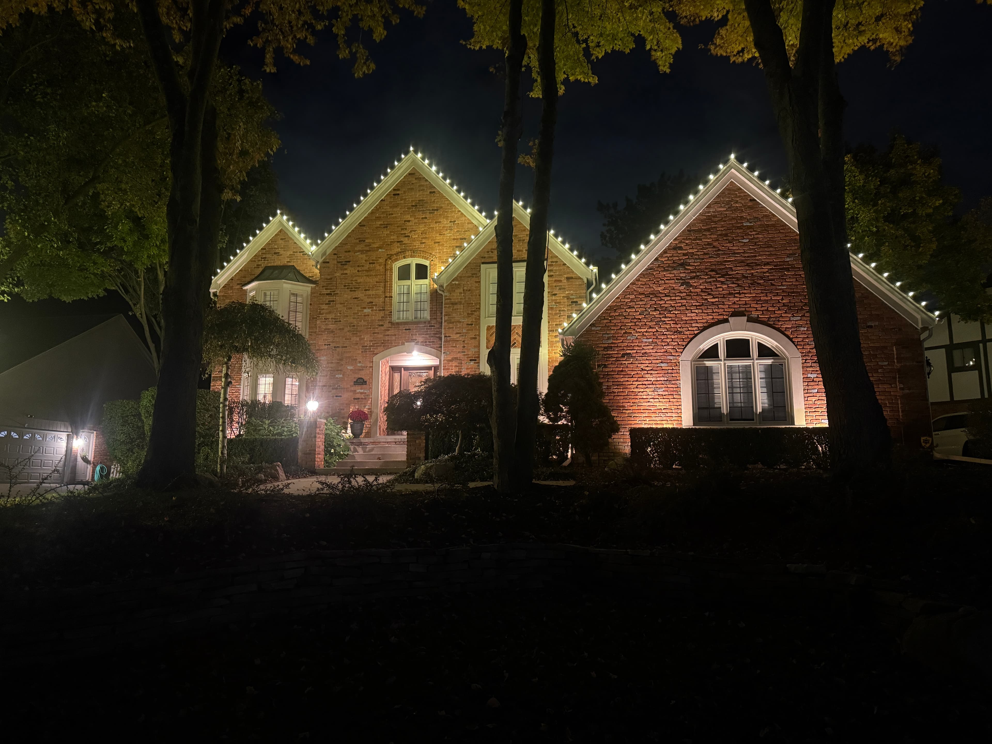 Beautiful home decorated with Christmas lights at night